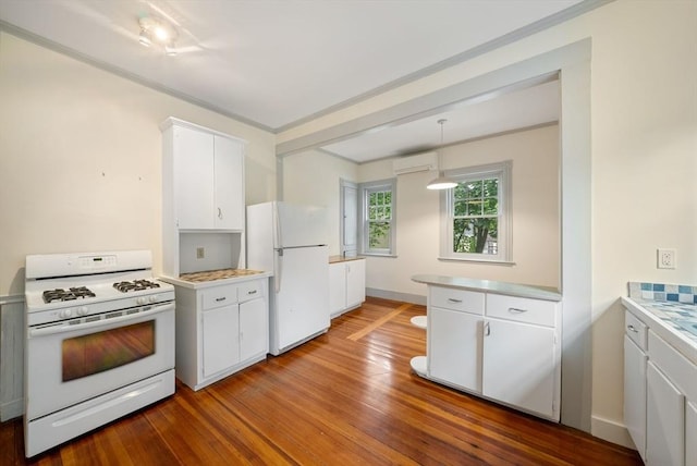 179 Rawson Unit 2, Brookline, MA 02445 - kitchen with white appliances, a wall mounted AC, white cabinetry, light countertops, and dark wood-type flooring