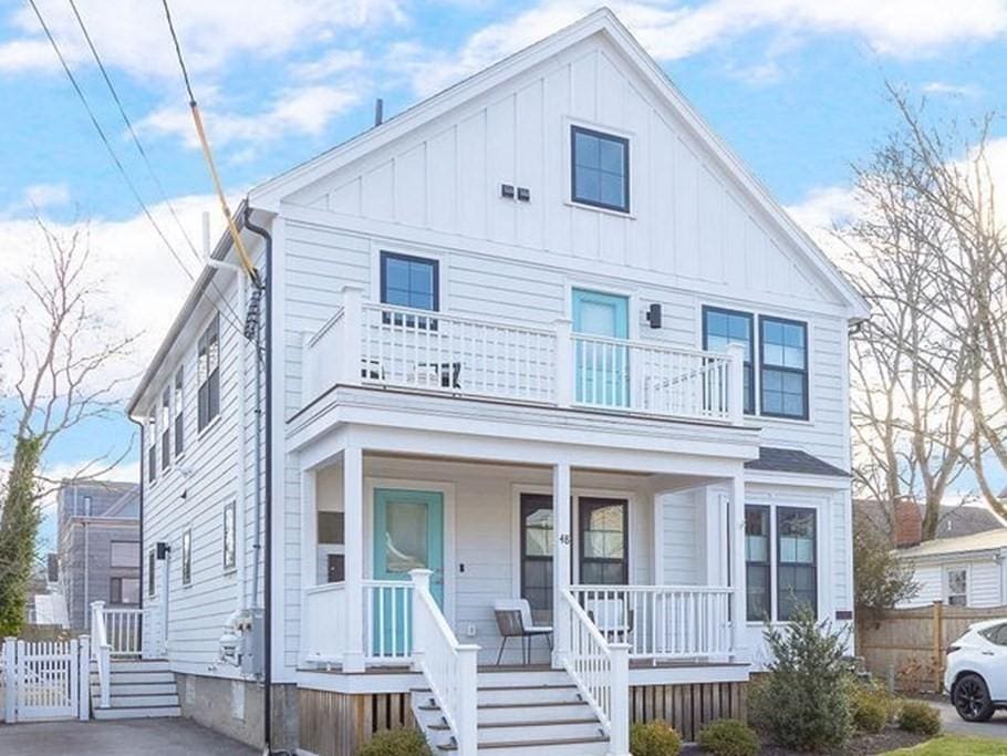 view of front of house with a balcony and a porch