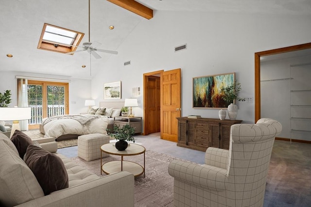 living area with visible vents, high vaulted ceiling, beamed ceiling, light carpet, and a skylight