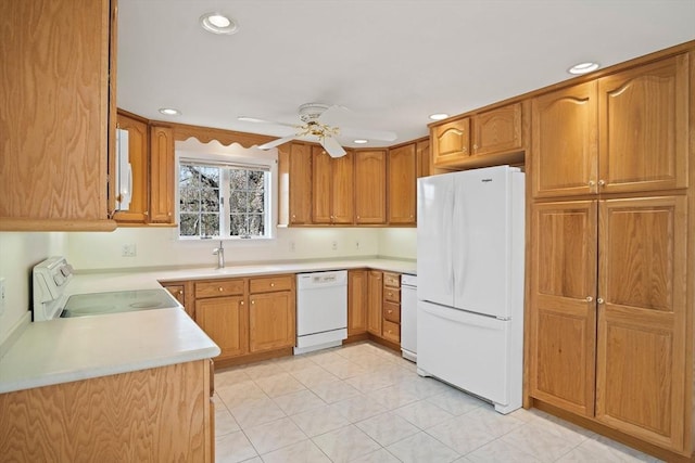 kitchen with recessed lighting, white appliances, ceiling fan, a sink, and light countertops