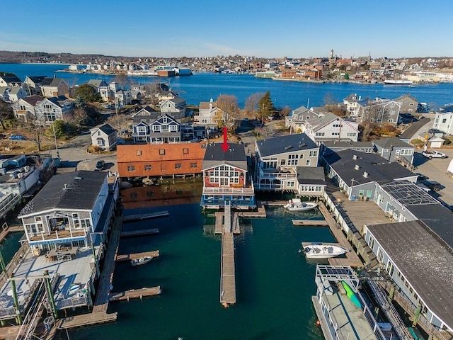 bird's eye view featuring a water view and a residential view