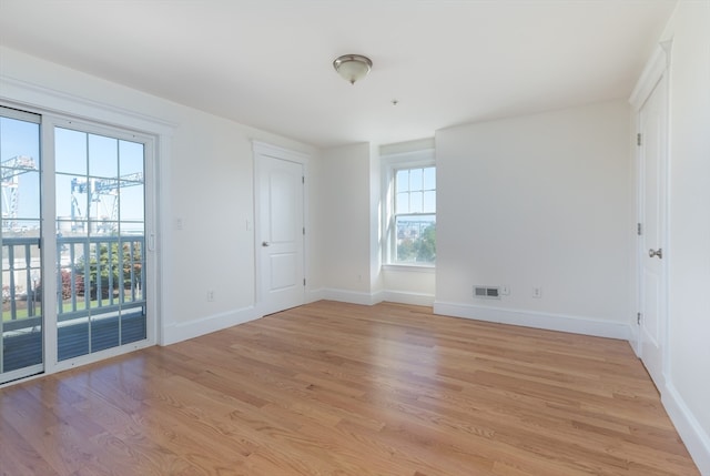 unfurnished room featuring light wood-type flooring