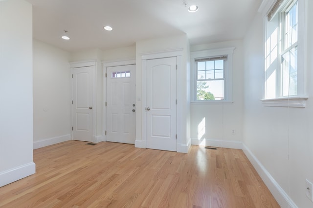 entrance foyer with light wood-type flooring