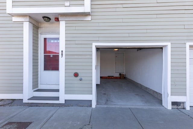 doorway to property featuring a garage