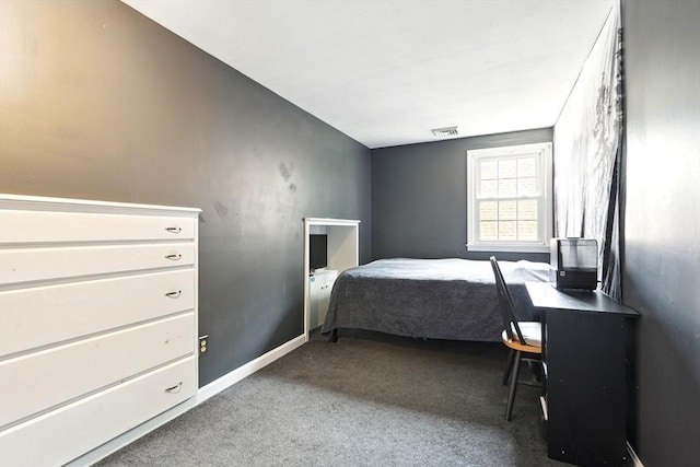 bedroom featuring carpet floors, baseboards, and visible vents