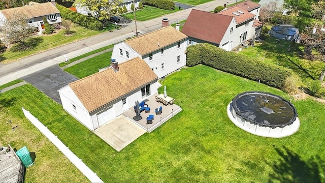 birds eye view of property with a residential view