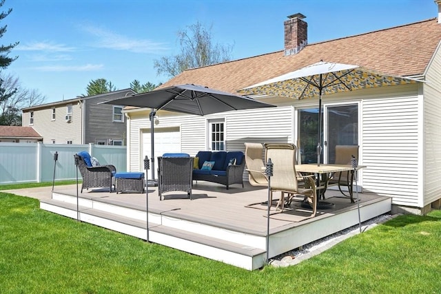 rear view of house with fence, roof with shingles, a deck, a chimney, and an outdoor living space