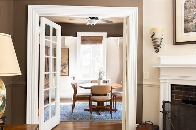 dining room featuring dark wood-type flooring and a ceiling fan