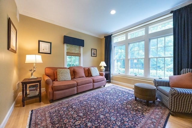 83 High Ridge Rd, Boxford, MA 01921 - living room with wood finished floors, crown molding, and recessed lighting