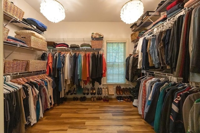 83 High Ridge Rd, Boxford, MA 01921 - spacious closet with a chandelier and wood finished floors