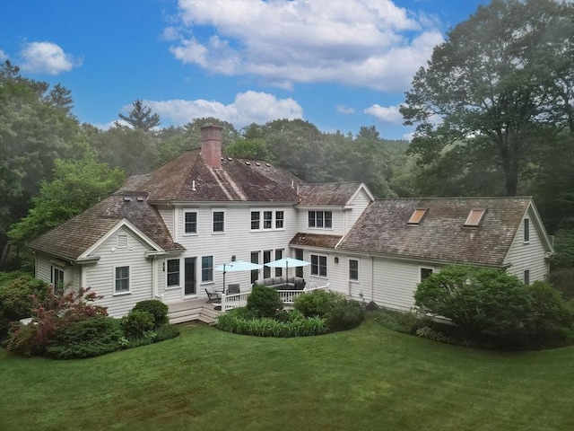 83 High Ridge Rd, Boxford, MA 01921 - rear view of property featuring a chimney, a lawn, and a wooden deck