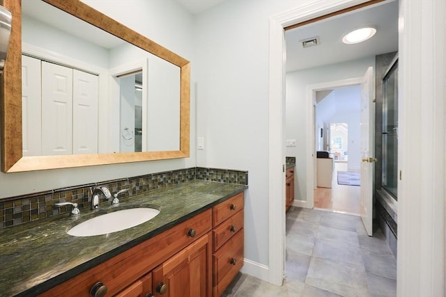 83 High Ridge Rd, Boxford, MA 01921 - full bathroom with vanity, decorative backsplash, and a shower with shower door