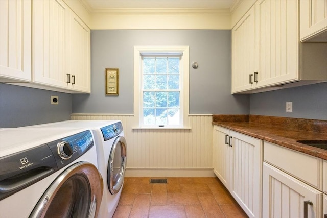 83 High Ridge Rd, Boxford, MA 01921 - washroom featuring cabinet space, a wainscoted wall, washing machine and dryer, and ornamental molding
