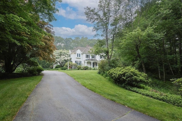83 High Ridge Rd, Boxford, MA 01921 - view of front of house with a front yard, asphalt driveway, and a chimney
