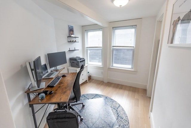 office area with baseboards and hardwood / wood-style floors