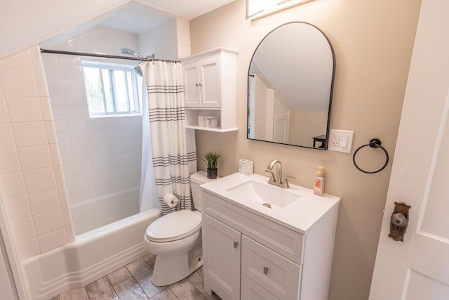 bathroom with vanity, shower / tub combo with curtain, and toilet