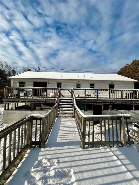 exterior space featuring a wooden deck