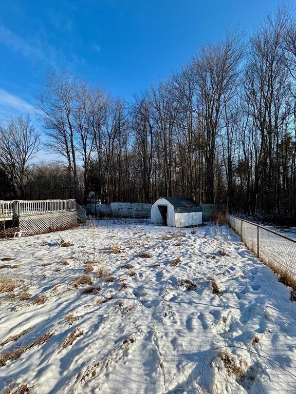 view of yard covered in snow