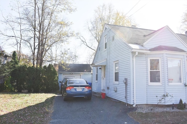 view of side of property with a garage