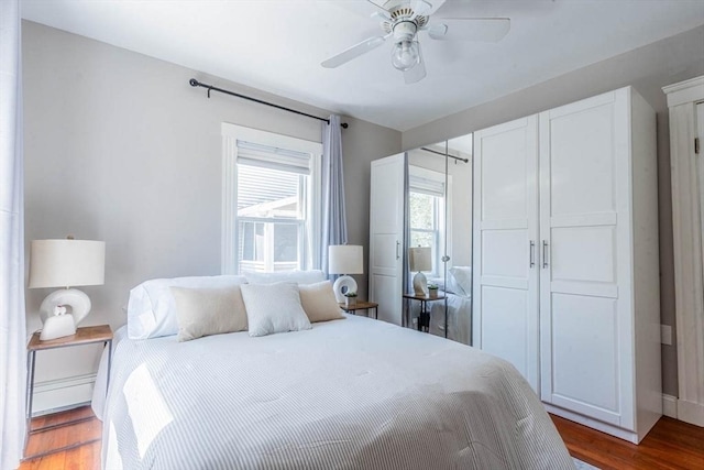 bedroom featuring wood finished floors and a ceiling fan