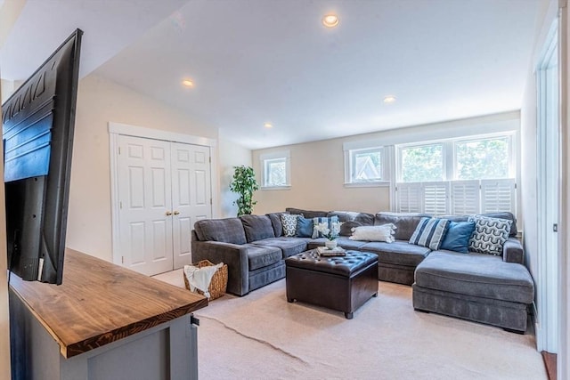 living room with light carpet and recessed lighting