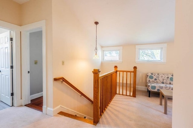 staircase with carpet floors and baseboards