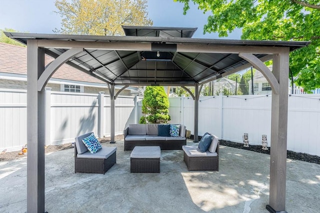view of patio featuring an outdoor living space, a gazebo, and a fenced backyard