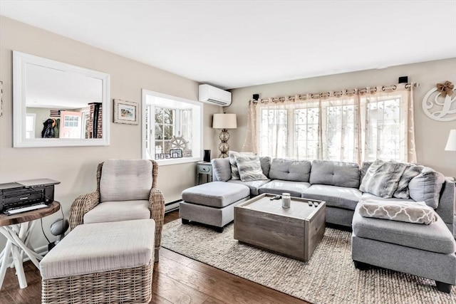 living room featuring baseboard heating, a wall unit AC, and wood-type flooring