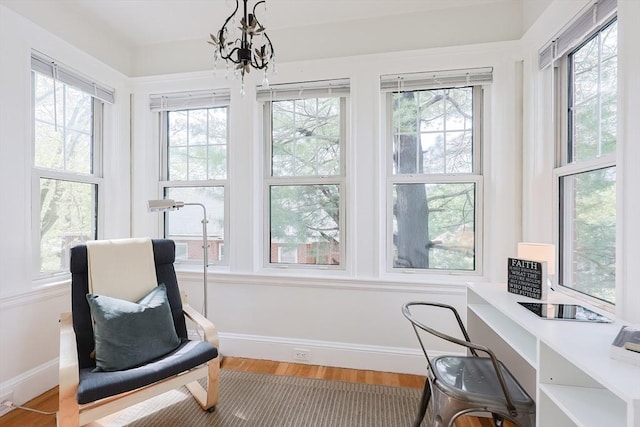 sunroom with a chandelier