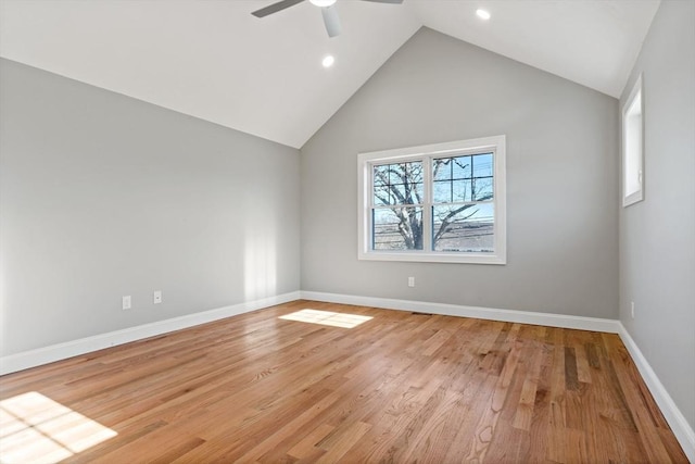 unfurnished room featuring high vaulted ceiling, light hardwood / wood-style floors, and ceiling fan