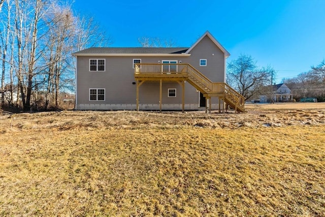 back of house with a yard and a deck