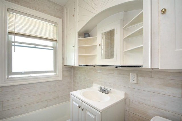 18 Morton St, Brockton, MA 02301 - bathroom featuring vanity, a bathtub, and backsplash