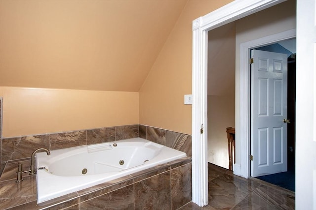 18 Morton St, Brockton, MA 02301 - bathroom featuring a tub with jets, marble tiled floors, and vaulted ceiling