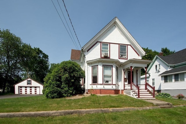 18 Morton St, Brockton, MA 02301 - victorian house with a porch, a garage, a front lawn, cooling unit, and an outdoor structure