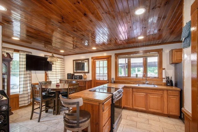 18 Morton St, Brockton, MA 02301 - kitchen featuring electric stove, wooden ceiling, ornamental molding, healthy amount of natural light, and recessed lighting