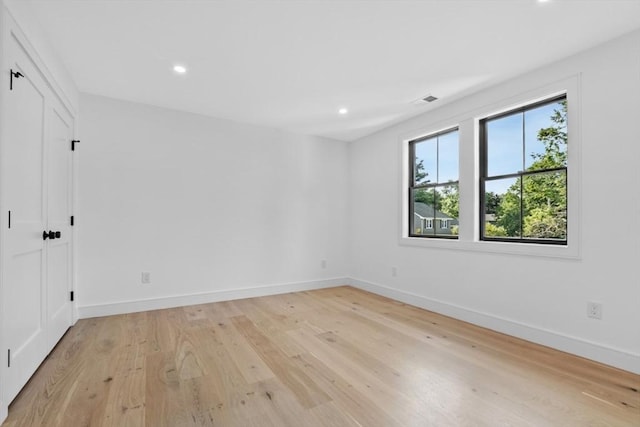 unfurnished room featuring light wood-type flooring