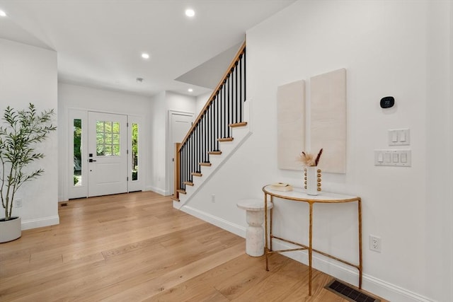 1 Cole Rd, Wayland, MA 01778 - entrance foyer featuring light wood-style flooring, stairway, recessed lighting, and baseboards