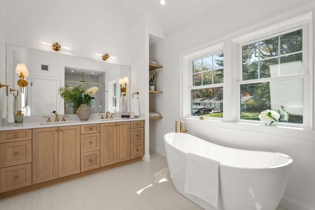 1 Cole Rd, Wayland, MA 01778 - full bathroom featuring double vanity, a shower, a freestanding tub, and baseboards