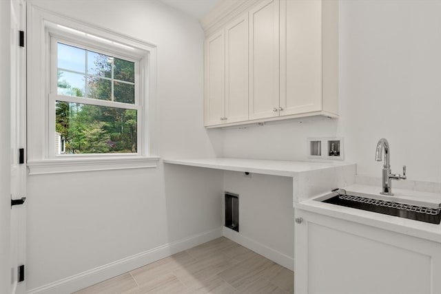 1 Cole Rd, Wayland, MA 01778 - laundry area featuring cabinet space, baseboards, and washer hookup