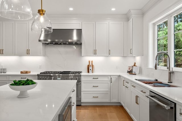 1 Cole Rd, Wayland, MA 01778 - kitchen with stainless steel appliances, wall chimney exhaust hood, a sink, healthy amount of natural light, and recessed lighting