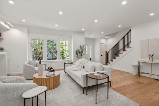 1 Cole Rd, Wayland, MA 01778 - living room featuring light wood finished floors, recessed lighting, stairway, and baseboards