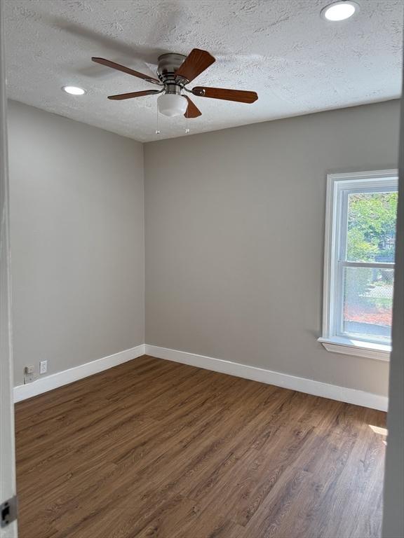 28 Foster St, Brockton, MA 02301 - unfurnished room featuring wood finished floors, a textured ceiling, recessed lighting, baseboards, and ceiling fan