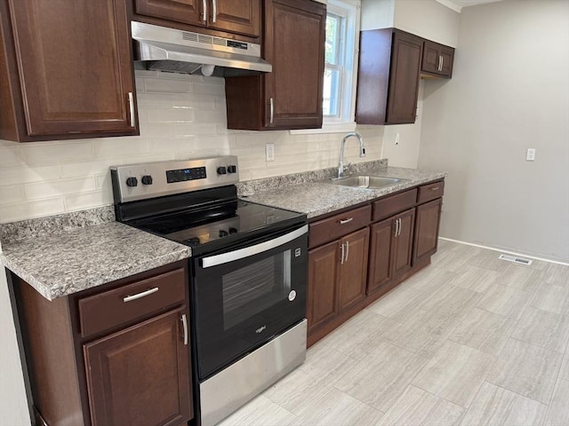 28 Foster St, Brockton, MA 02301 - kitchen featuring under cabinet range hood, stainless steel electric stove, a sink, and backsplash
