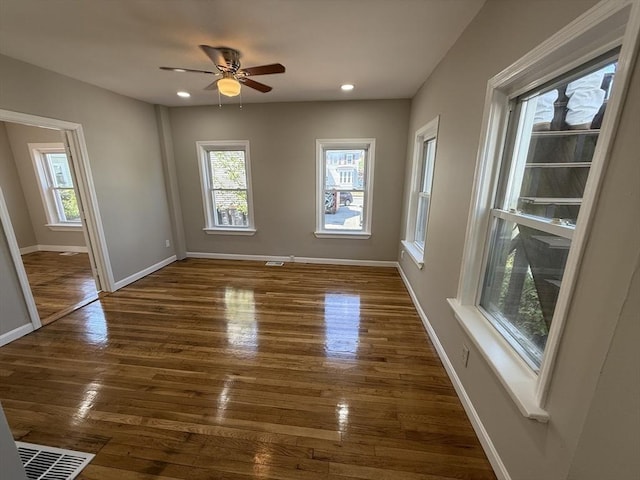 28 Foster St, Brockton, MA 02301 - empty room featuring plenty of natural light, baseboards, wood finished floors, recessed lighting, and ceiling fan