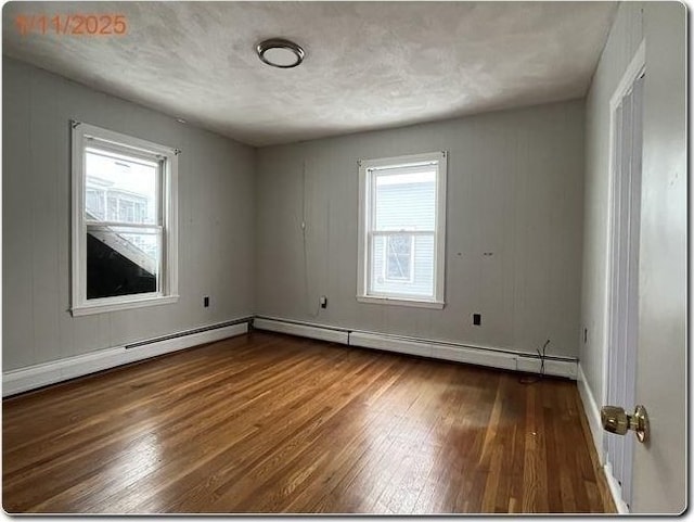 unfurnished room with hardwood / wood-style floors