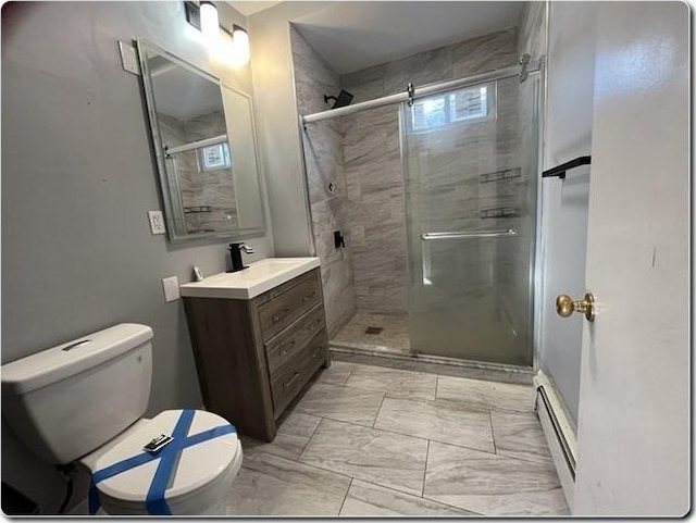 bathroom with vanity, a baseboard heating unit, toilet, and walk in shower