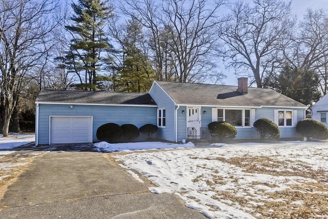 ranch-style home featuring a garage