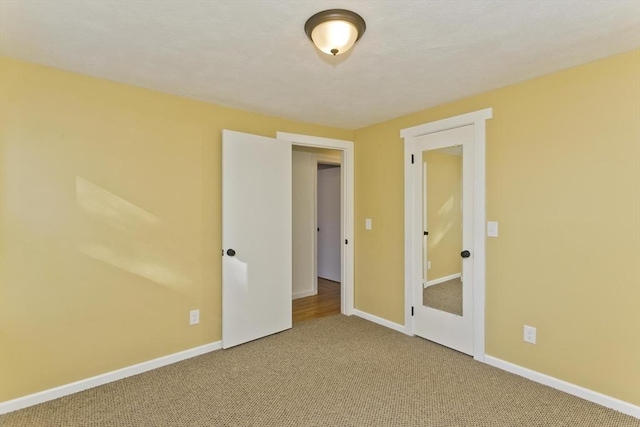 empty room featuring carpet floors