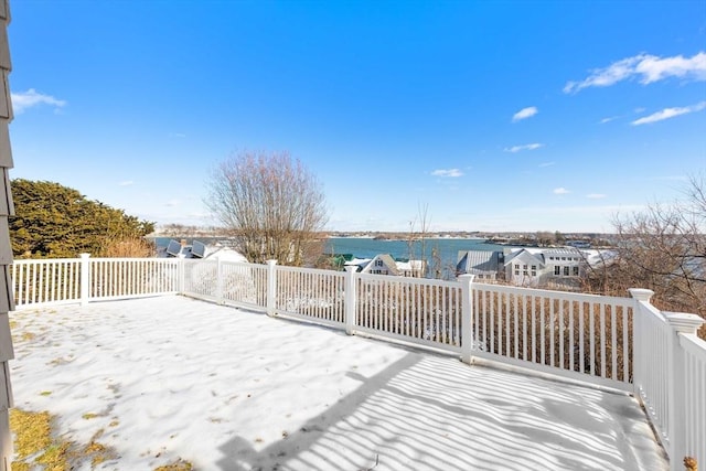 wooden deck featuring a water view