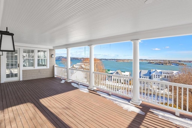 wooden deck featuring a water view